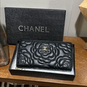 Black Floral Embossed wallet with iconic logo.